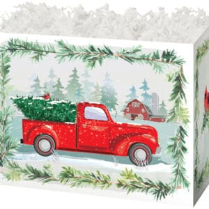 A red truck carrying a christmas tree in the back of it.