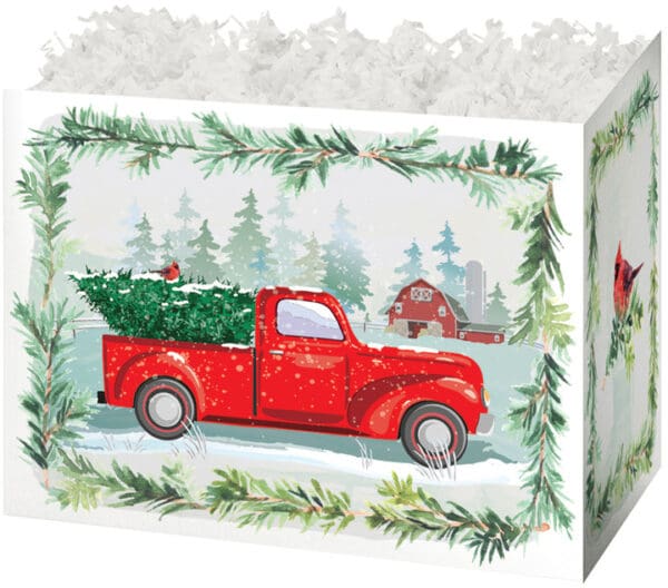 A red truck carrying a christmas tree in the back of it.